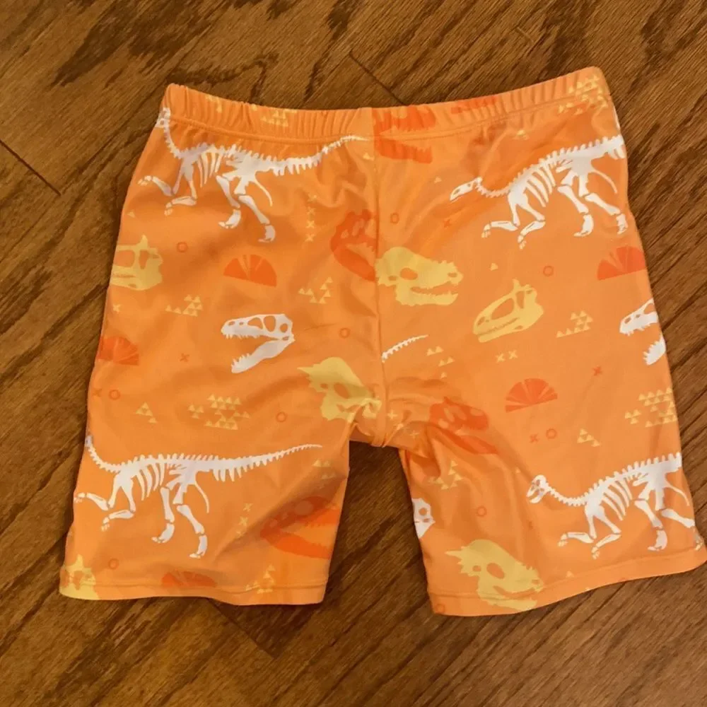NWOT boys or girls swim shorts size 152 which is an 11/12 - dinosaurs, orange